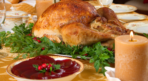 Thanksgiving turkey with cranberry sauce and candle