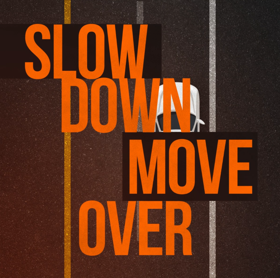 car driving on the road with the words slow down move over